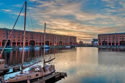a boat docked at a dock in a marina at Finest Retreats - The Houseboat, Liverpool Marina in Liverpool