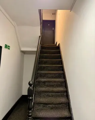 a flight of stairs in an office building at The Coningsby Staycation in Liverpool