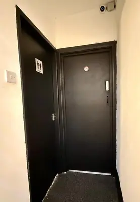 a black door in a room with a hallway at The Coningsby Staycation in Liverpool