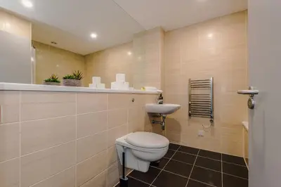 a bathroom with a toilet and a sink at Luxury 2-Bed Apt by Royal Albert Dock & M&S Arena in Liverpool