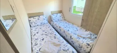 a couple of beds in a small room at Shellie's Summer Breeze Retreat in Heysham