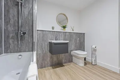 a bathroom with a toilet and a shower and a sink at Oriel Residence - 2BR - 4 Beds - Sleeps 5 in Liverpool
