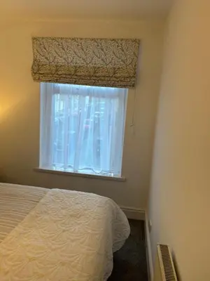 a bedroom with a bed and a window at Beautiful 3 bedroom home, Dorrington Terrace in Lancaster