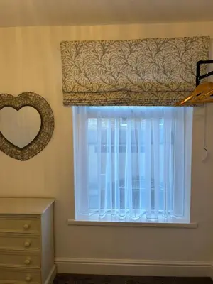 a window with a curtain and a dresser and a mirror at Beautiful 3 bedroom home, Dorrington Terrace in Lancaster