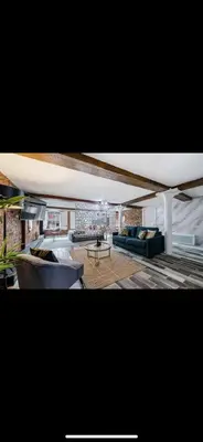a living room with a couch and a table at Stylish Studio Apartment in Liverpool