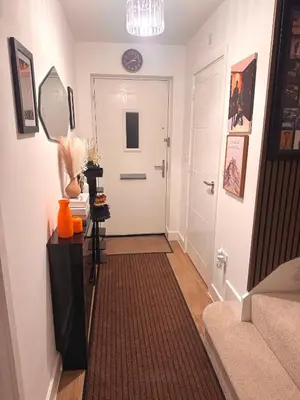 a hallway with a white door and a mirror at Room in Blackburn - Peters Place in Lower Darwen