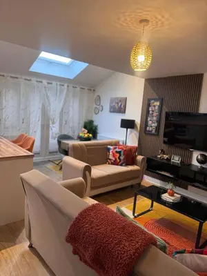 a living room with two couches and a television at Room in Blackburn - Peters Place in Lower Darwen