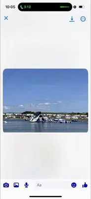 a screenshot of a phone screen with a view of the ocean at Trailer by the sea in Millom