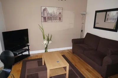 a living room with a couch and a coffee table at South Beach Apartments in Blackpool