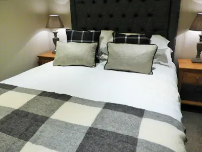 a bedroom with a large white bed with two pillows at The Fenwick in Lancaster