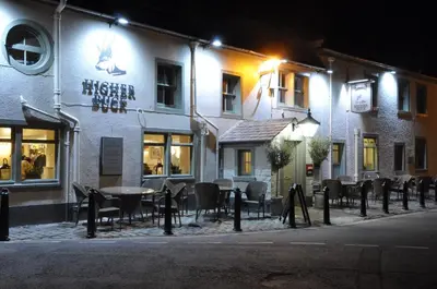 a restaurant with tables and chairs in front of a building at Higher Buck Inn in Waddington