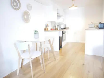 a kitchen with a table and chairs in a room at Nordic Suites Apartments, Ulverston in Ulverston