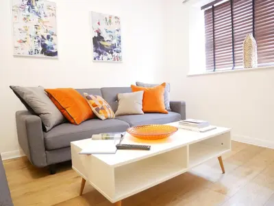 a living room with a couch and a coffee table at Nordic Suites Apartments, Ulverston in Ulverston