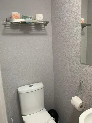 a bathroom with a white toilet and a sink at The Woodleigh family hotel in Blackpool