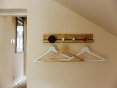 a room with three hangers on a wall at Langs Hall in Leyland