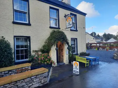 a building with a sign in front of it at The Ship Inn in Bardsea