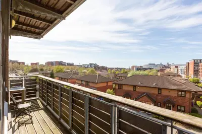 a balcony with a view of the city at Liverpool City Centre Apartments - East Village in Liverpool