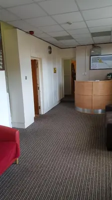 an empty room with a waiting area in a hospital at The Lodge Guest Accommodation in Barrow in Furness