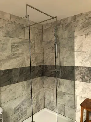 a shower with a glass door in a bathroom at Ten Streets Bed & Breakfast in Liverpool