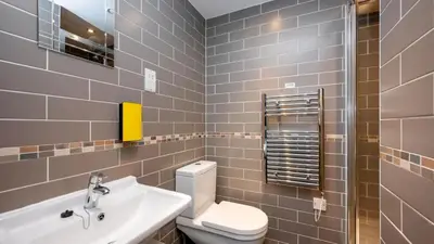 a bathroom with a white toilet and a sink at Staycity Aparthotels Liverpool City Centre in Liverpool