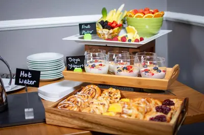 a buffet with two trays of food on a table at Holiday Inn Liverpool City Centre by IHG in Liverpool