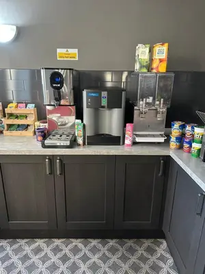 a kitchen with a counter with a coffee maker at The Villa Hotel in Blackpool