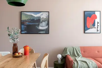 a living room with a table and a couch at Cove Paradise Street in Liverpool
