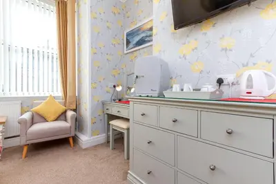 a childrens room with a hair dryer on a dresser at Valentine Lodge Over 21 Adult Couples Only in Blackpool