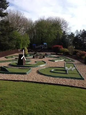 a park with a bunch of miniature golf courses at Fenna Lakeside Lodge - Pine Lake Resort in Carnforth