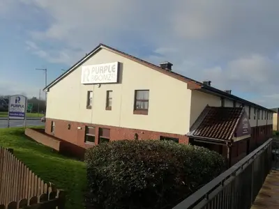 a building with a sign that reads private house at Purple Roomz Preston South in Preston