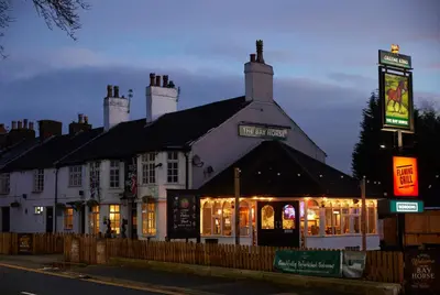 a building with a sign in front of it at The Bay Horse Hotel in Haydock