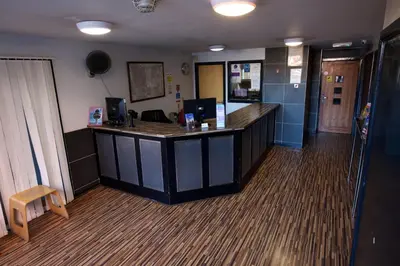 an office with a reception desk in a room at International Inn in Liverpool