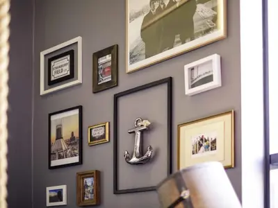 a wall with pictures and photos on a wall at Novotel Liverpool Centre in Liverpool