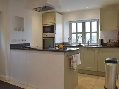 a kitchen with a counter top and a sink at Five Barred Gate Barn in Inglewhite