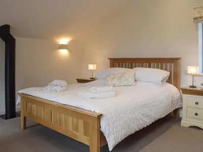 a bedroom with a bed with two towels on it at Five Barred Gate Barn in Inglewhite