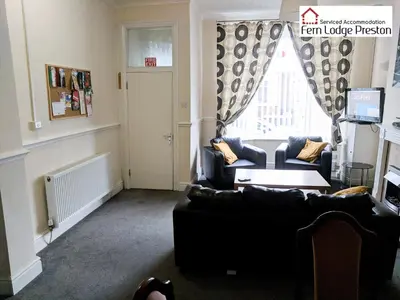 a living room with two couches and a window at 4 Bedroom House at Fern Lodge Preston Serviced Accommodation - Free WiFi & Parking in Preston