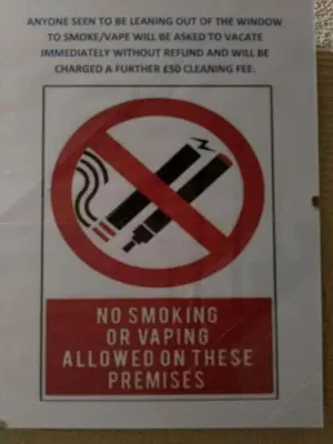 a sign that says no smoking or wavering frequencies at Lynmoore Guest House in Blackpool
