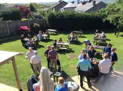 a group of people standing around in a yard at The Lord Nelson Inn B&B in Langho
