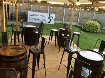 a group of drums and stools under a tent at The Lord Nelson Inn B&B in Langho