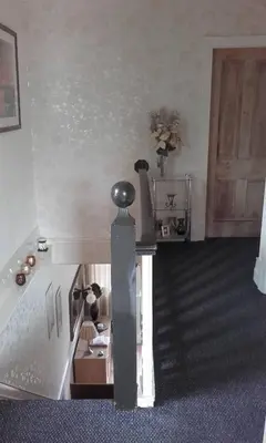 a model of a room with a staircase and a door at EsJays at Knowles House in Lytham St Annes
