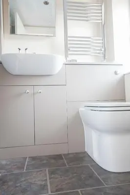 a white bathroom with a sink and a toilet at Stanley Lodge Farmhouse in Cockerham