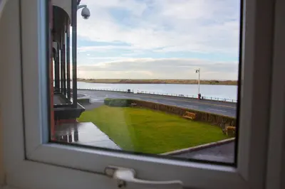 a view of a pier from a window at Promenade Apartments in Southport