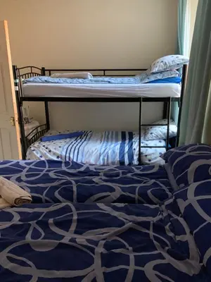 a bedroom with two bunk beds in a room at The Blue Moon in Blackpool