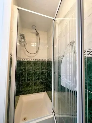 a shower with a glass enclosure in a bathroom at Bella Vista Lodge in Blackpool
