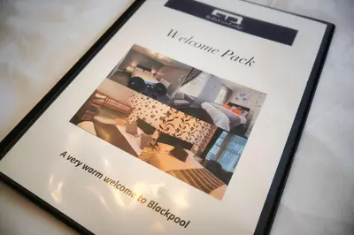 a cell phone screen with a picture of a living room at Bella Vista Lodge in Blackpool