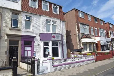a group of buildings on a city street at MyRoomz Orchid Hotel in Blackpool