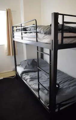 a couple of bunk beds in a room at MyRoomz Orchid Hotel in Blackpool
