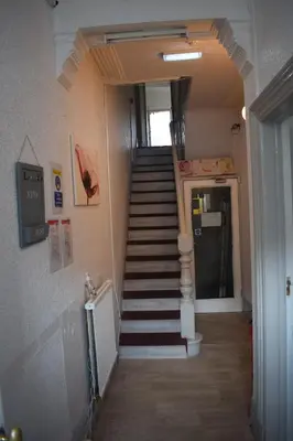 a staircase in a building with a stair case at MyRoomz Orchid Hotel in Blackpool