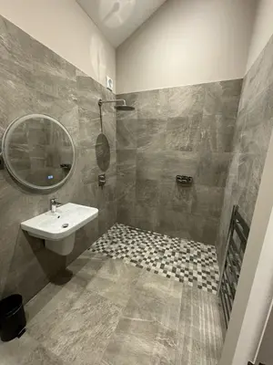 a bathroom with a sink and a mirror at 3 Millstones Inn in West Bradford