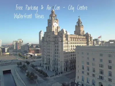 a large building with a clock tower on top of it at Excelsior Apartments - Liverpool Central - Free Parking - AirCon in Liverpool